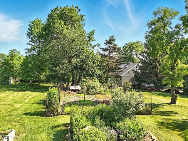 5105 E Sprague Rd, Independence, OH 44131 - view of green lawn featuring a vegetable garden