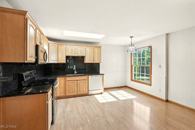 5105 E Sprague Rd, Independence, OH 44131 - kitchen featuring dishwasher, range with electric stovetop, stainless steel microwave, and light wood-type flooring