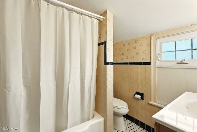 5105 E Sprague Rd, Independence, OH 44131 - bathroom with tile walls, vanity, shower / bath combination with curtain, and tile patterned flooring