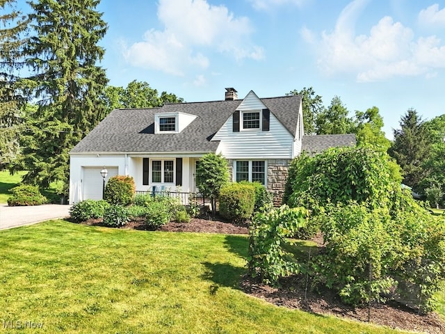 5105 E Sprague Rd, Independence, OH 44131 - view of front of house with a chimney, a front yard, driveway, and a garage