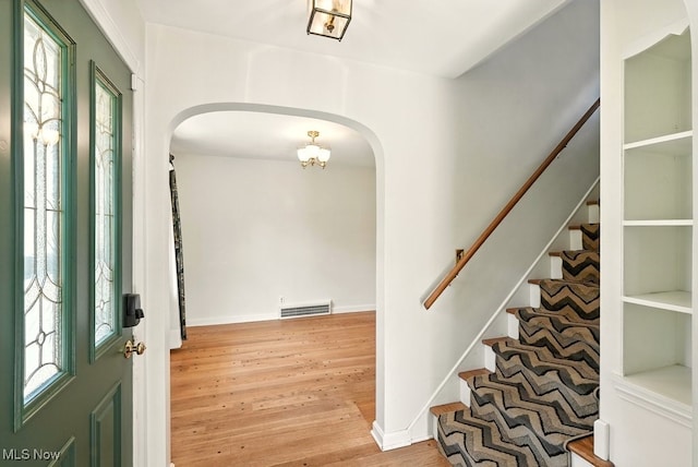 5105 E Sprague Rd, Independence, OH 44131 - foyer featuring arched walkways, wood finished floors, and stairway
