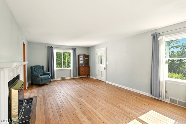 5105 E Sprague Rd, Independence, OH 44131 - unfurnished room featuring light wood-style flooring and a fireplace