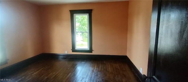 1134 E Main St, Coshocton, OH 43812 - spare room with wood-type flooring and baseboards