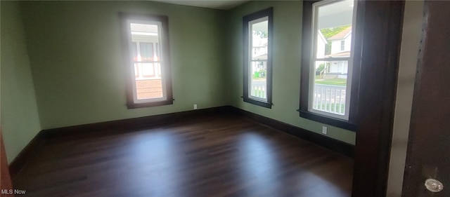 1134 E Main St, Coshocton, OH 43812 - spare room with dark wood-type flooring and plenty of natural light