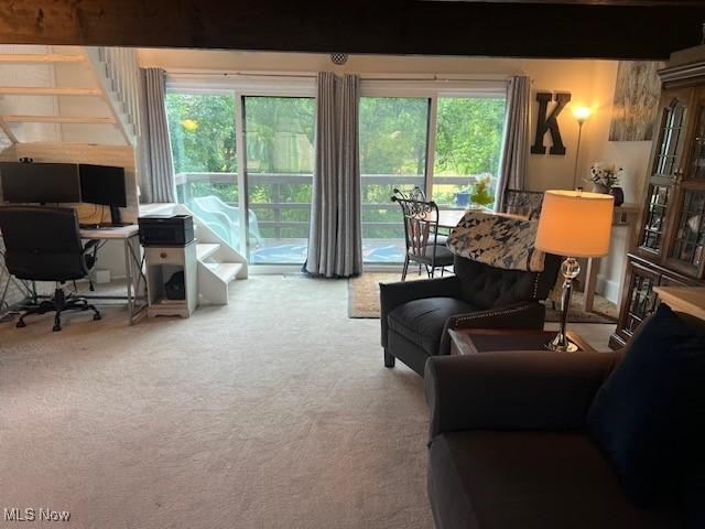 2091 Penguin Ave, Akron, OH 44319 - carpeted living area with an office area, healthy amount of natural light, and stairs
