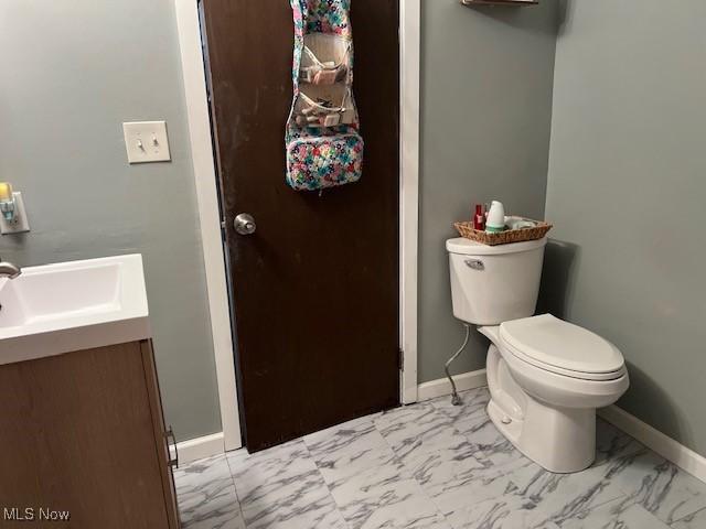 2091 Penguin Ave, Akron, OH 44319 - half bathroom featuring marble look tiles and vanity
