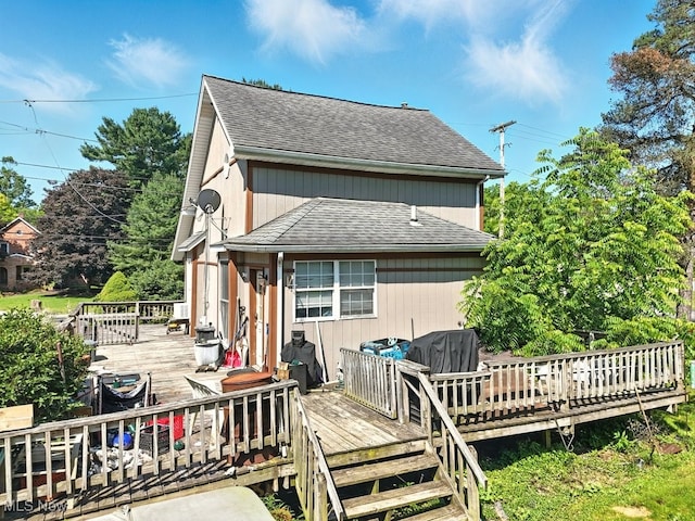 8505 Olde 8 Rd, Northfield Center, OH 44067 - rear view of property with a wooden deck and roof with shingles