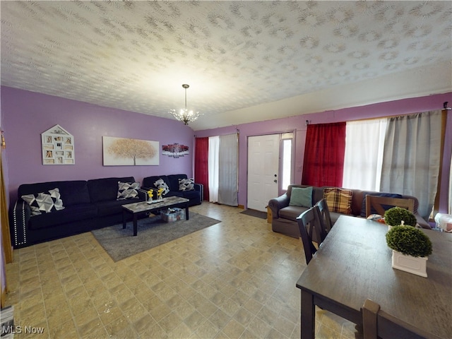 2027 Lexington Ave, Lorain, OH 44052 - living room featuring a chandelier and a textured ceiling