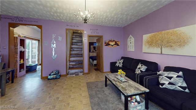 2027 Lexington Ave, Lorain, OH 44052 - living room with a textured ceiling, a chandelier, and stairs