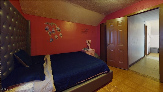 2027 Lexington Ave, Lorain, OH 44052 - bedroom with a textured ceiling and lofted ceiling