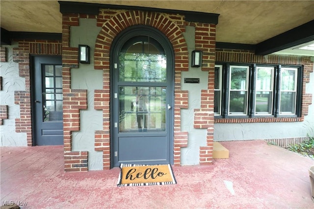 1120 Delia Ave, Akron, OH 44320 - entrance to property featuring brick siding and covered porch