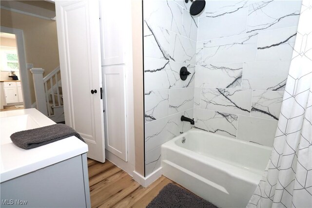 1120 Delia Ave, Akron, OH 44320 - bathroom featuring wood finished floors, shower / bath combo, and vanity