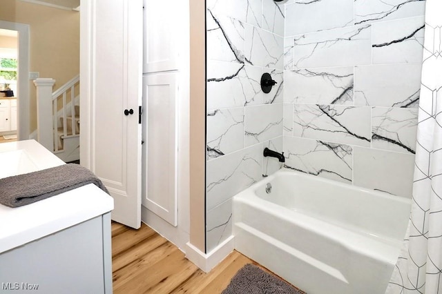 1120 Delia Ave, Akron, OH 44320 - bathroom with wood finished floors, shower / bath combo with shower curtain, and vanity