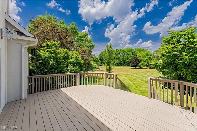 4837 Arbour Green Dr, Bath, OH 44333 - wooden deck featuring a lawn and view of wooded area