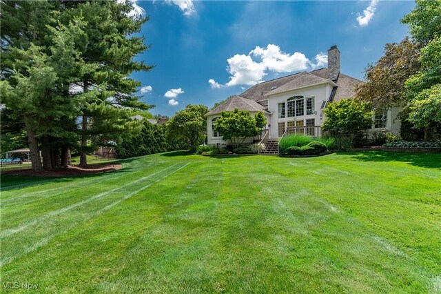 4837 Arbour Green Dr, Bath, OH 44333 - view of grassy yard with a wooden deck