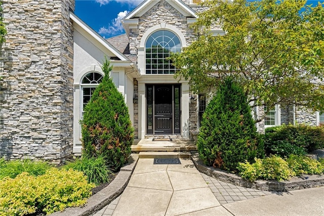 4837 Arbour Green Dr, Bath, OH 44333 - entrance to property with stone siding and stucco siding