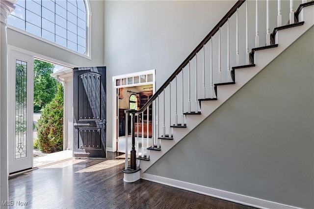 4837 Arbour Green Dr, Bath, OH 44333 - entryway featuring wood finished floors, a high ceiling, and stairway