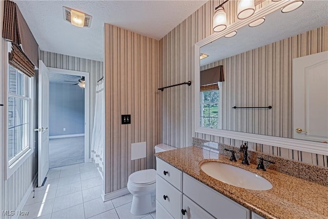4837 Arbour Green Dr, Bath, OH 44333 - bathroom featuring wallpapered walls, a textured ceiling, vanity, tile patterned flooring, and a ceiling fan