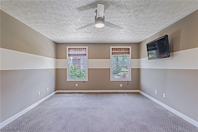 4837 Arbour Green Dr, Bath, OH 44333 - spare room with healthy amount of natural light, ceiling fan, carpet flooring, and a textured ceiling