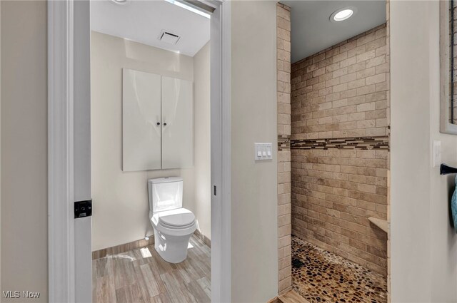 561 Willard Rd, Aurora, OH 44202 - bathroom with a tile shower and wood finished floors
