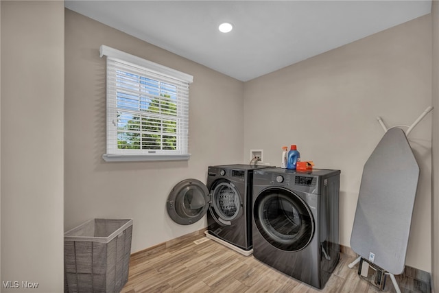 561 Willard Rd, Aurora, OH 44202 - laundry area featuring washing machine and clothes dryer, wood finished floors, and recessed lighting
