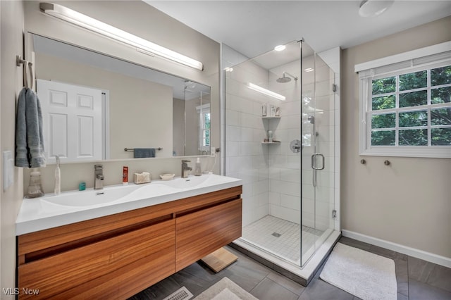 561 Willard Rd, Aurora, OH 44202 - bathroom with tile patterned flooring, double vanity, and a shower stall
