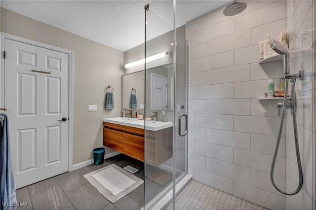 561 Willard Rd, Aurora, OH 44202 - bathroom with a stall shower, double vanity, and tile patterned flooring