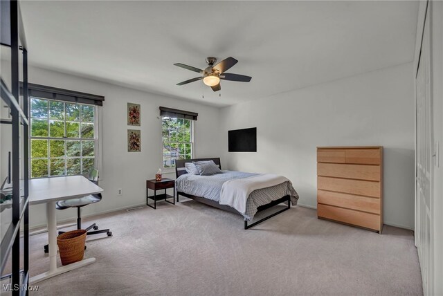 561 Willard Rd, Aurora, OH 44202 - carpeted bedroom with a ceiling fan and baseboards