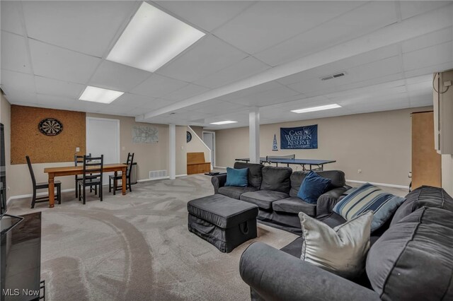 561 Willard Rd, Aurora, OH 44202 - living area featuring light carpet, a paneled ceiling, and stairway