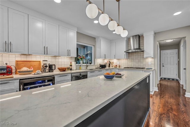 561 Willard Rd, Aurora, OH 44202 - kitchen with wall chimney exhaust hood, wine cooler, recessed lighting, stainless steel dishwasher, and white cabinets