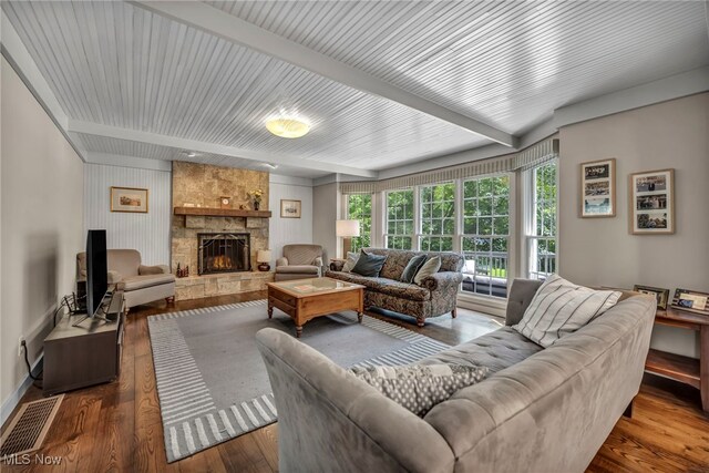 561 Willard Rd, Aurora, OH 44202 - living room with beam ceiling, wood finished floors, and a fireplace