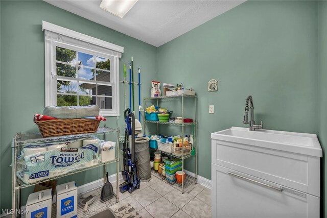 561 Willard Rd, Aurora, OH 44202 - laundry room with baseboards and tile patterned floors