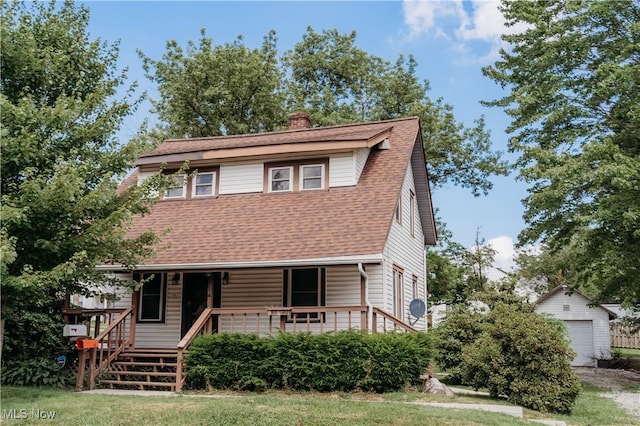 114 Hillcrest St, Ravenna, OH 44266 - view of front of property with an outdoor structure, a porch, a chimney, and roof with shingles