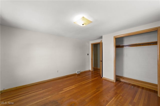 4038 Wandsworth Rd, South Euclid, OH 44121 - unfurnished bedroom with wood finished floors and a closet