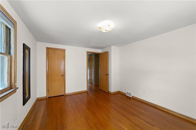 4038 Wandsworth Rd, South Euclid, OH 44121 - unfurnished bedroom featuring wood finished floors and baseboards
