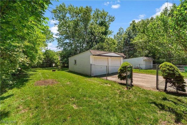 4038 Wandsworth Rd, South Euclid, OH 44121 - view of yard featuring a detached garage and an outbuilding