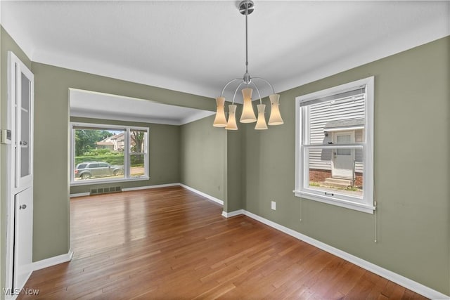 4038 Wandsworth Rd, South Euclid, OH 44121 - spare room featuring a chandelier and hardwood / wood-style flooring