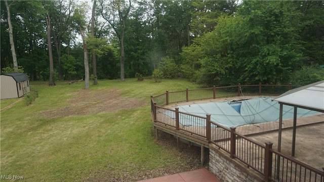 1519 Mctaggart Rd, Stow, OH 44224 - view of swimming pool featuring a yard, a storage unit, and a covered pool