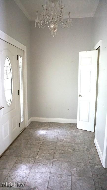 1519 Mctaggart Rd, Stow, OH 44224 - entrance foyer with crown molding and a chandelier