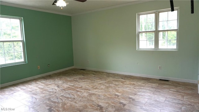 1519 Mctaggart Rd, Stow, OH 44224 - empty room with healthy amount of natural light, a ceiling fan, and ornamental molding