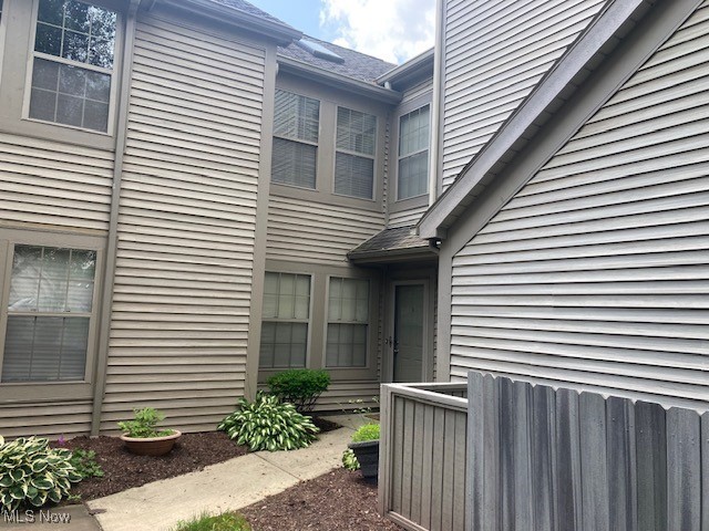 205 S Aspen Unit 4, Warren, OH 44484 - view of exterior entry featuring roof with shingles