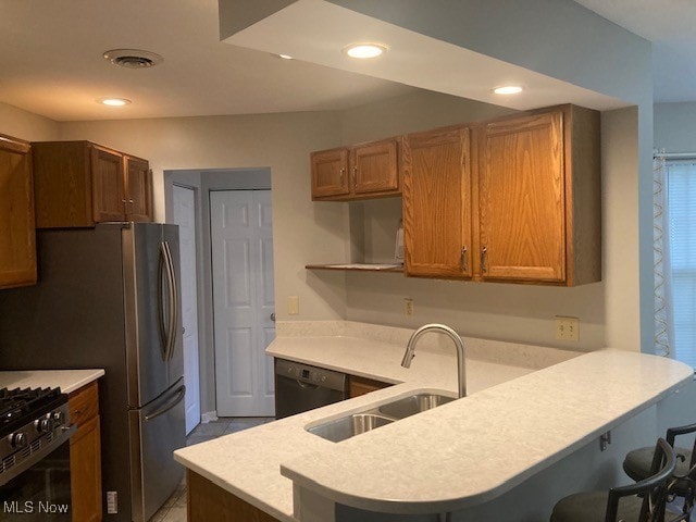 205 S Aspen Unit 4, Warren, OH 44484 - kitchen with a peninsula, dishwasher, light countertops, a kitchen breakfast bar, and open shelves