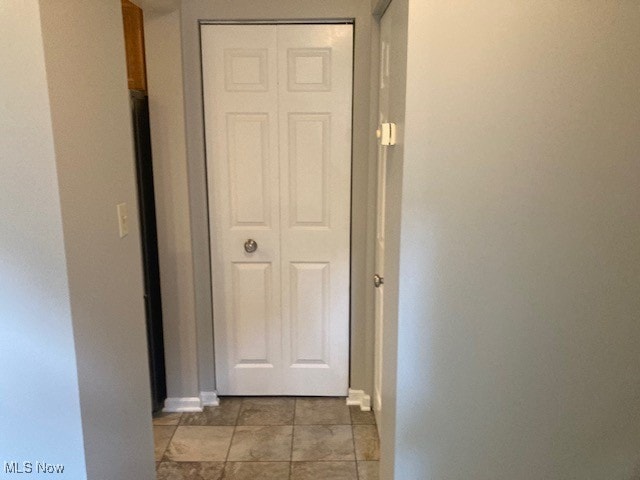 205 S Aspen Unit 4, Warren, OH 44484 - hallway featuring light tile patterned floors and baseboards