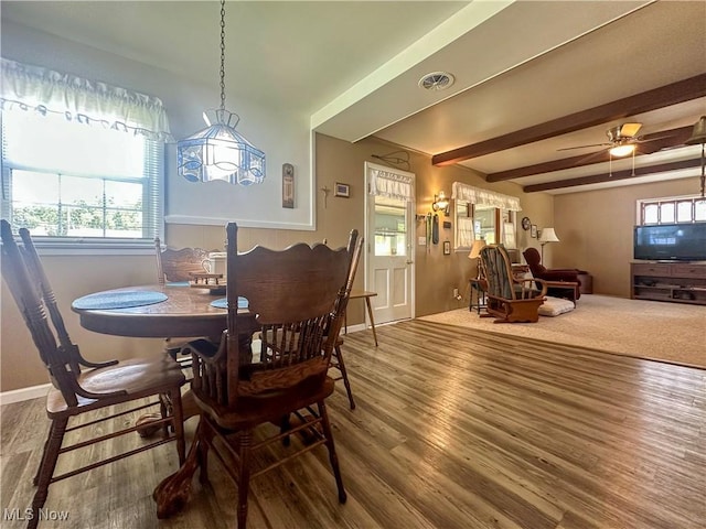 30 Bond St, Niles, OH 44446 - dining area with wood finished floors, beamed ceiling, and a chandelier
