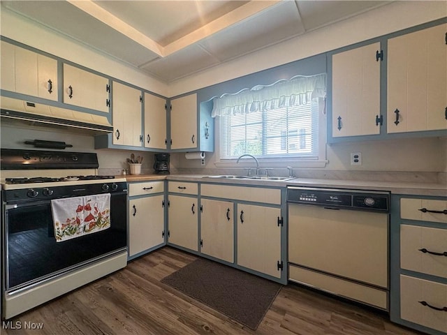 30 Bond St, Niles, OH 44446 - kitchen with white appliances, under cabinet range hood, dark wood-type flooring, and light countertops