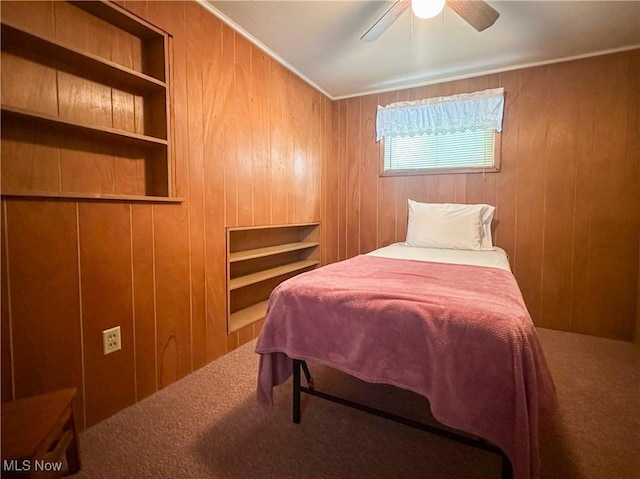 30 Bond St, Niles, OH 44446 - carpeted bedroom featuring wood walls and ceiling fan