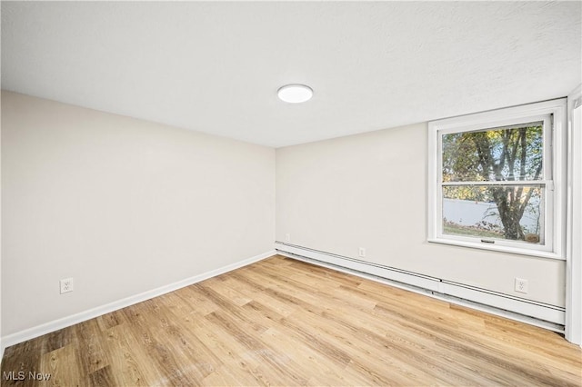 30529 Ridge Rd, Wickliffe, OH 44092 - spare room featuring baseboard heating and wood finished floors