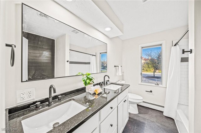 30529 Ridge Rd, Wickliffe, OH 44092 - full bathroom with baseboard heating, double vanity, and shower / tub combo