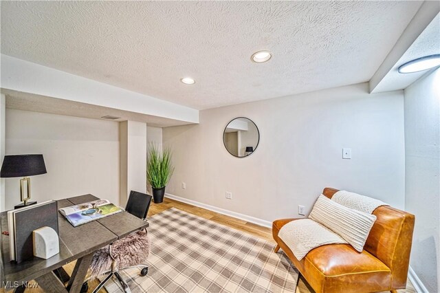 30529 Ridge Rd, Wickliffe, OH 44092 - home office with light wood-style flooring, recessed lighting, and a textured ceiling