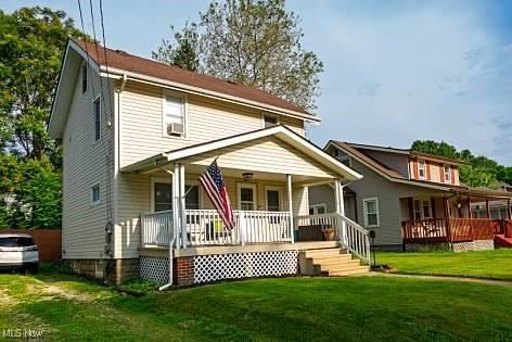 522 Lamont St, Akron, OH 44305 - rear view of property featuring a porch and a lawn